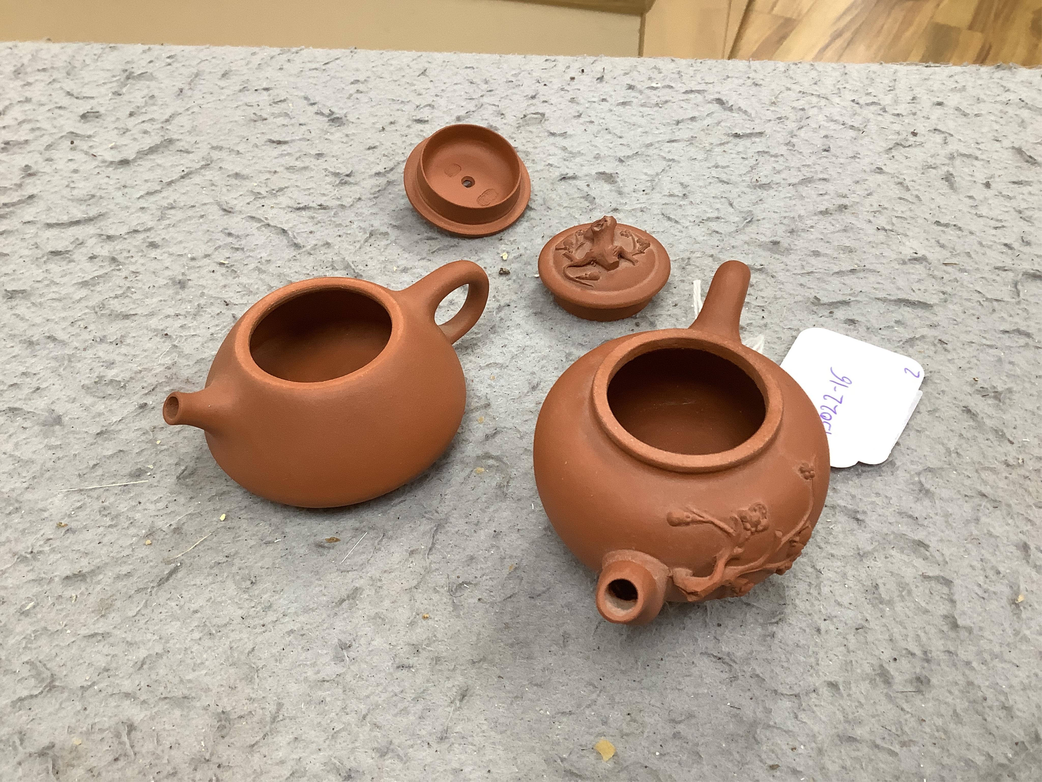 Two Chinese Yixing small teapots, largest 11.5cm wide. Condition - good